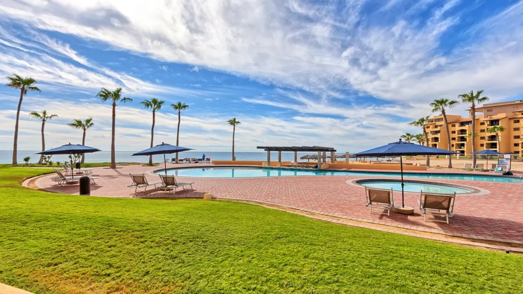 Ground-floor beachfront patio with direct access to the heated oceanfront pool and Sandy Beach at Princesa Resort