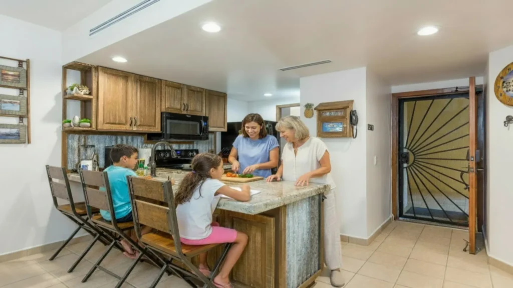Fully equipped kitchen and dining area inside a beachfront vacation condo