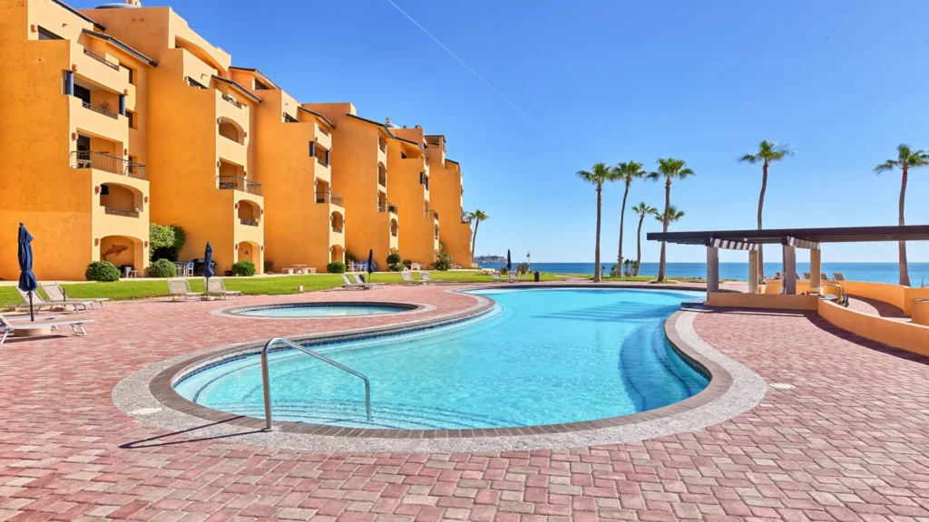 E Pool at Princesa Resort with swim-up bar and ocean views near beachfront condos
