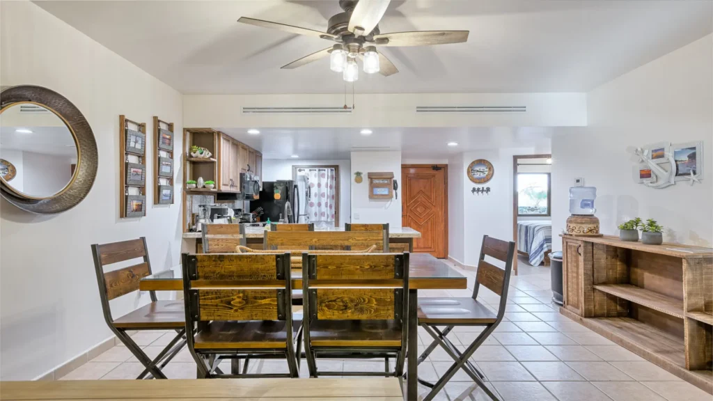 Dining area with table seating for groups inside beachfront condo