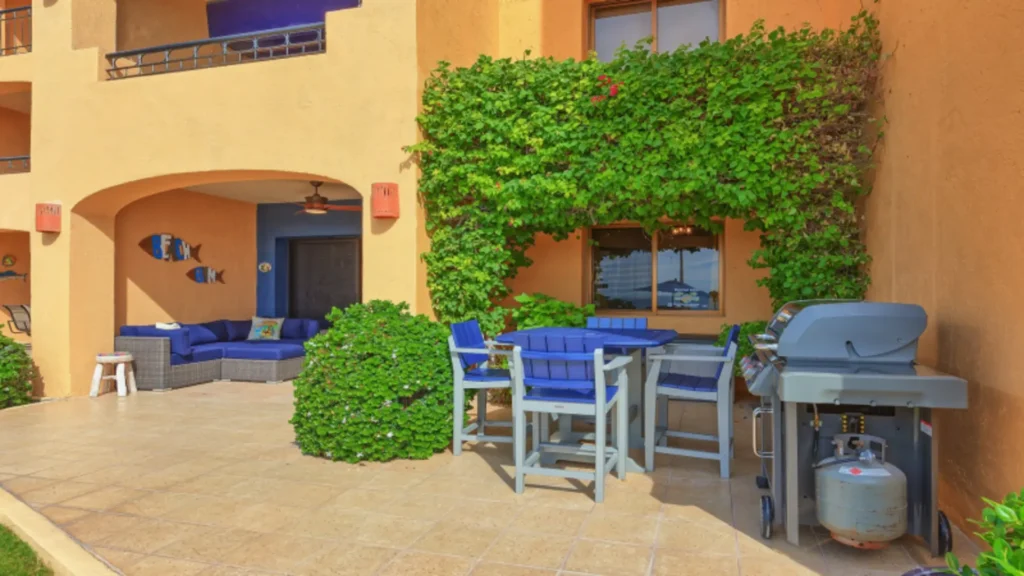 Private beachfront patio with Weber Genesis propane grill at Sandy Beach condo