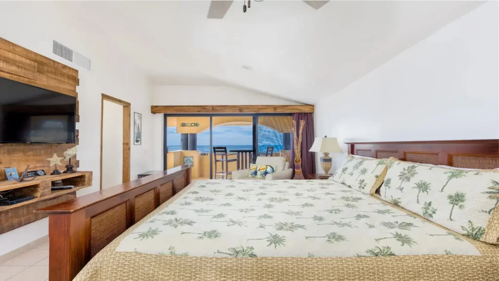 Master bedroom with private beachfront patio and ocean views