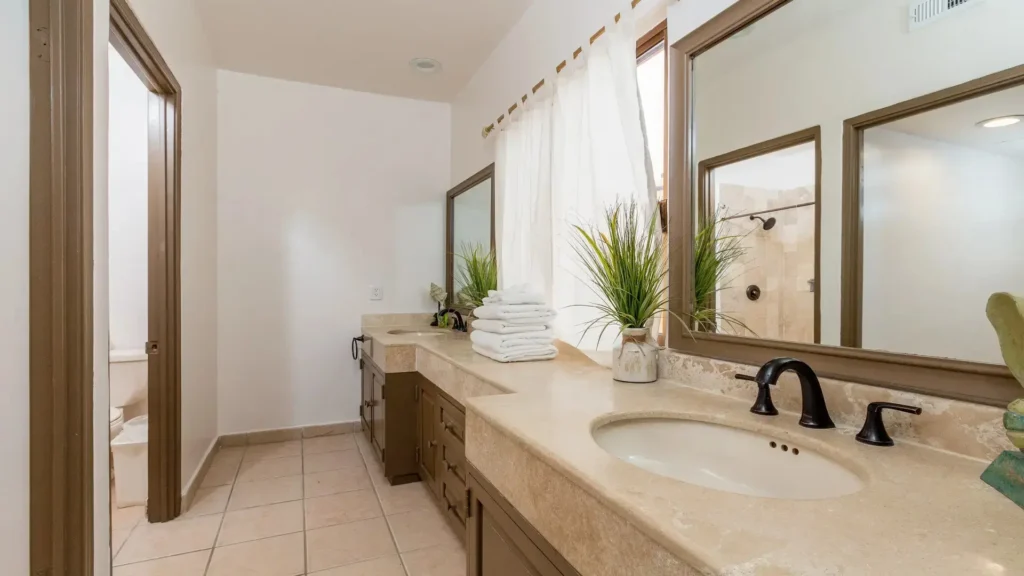 Large master bathroom with bright lighting and spacious layout