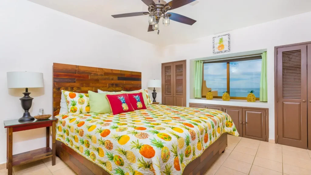 Pineapple themed bedroom with tropical decor in beachfront condo