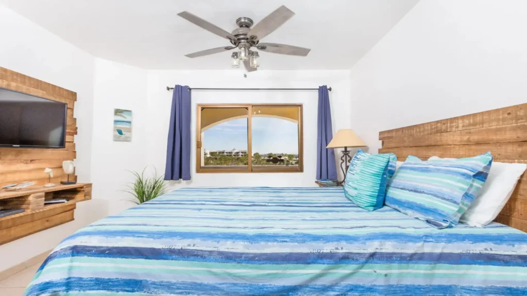 Cozy main floor bedroom with queen bed and calming coastal tones