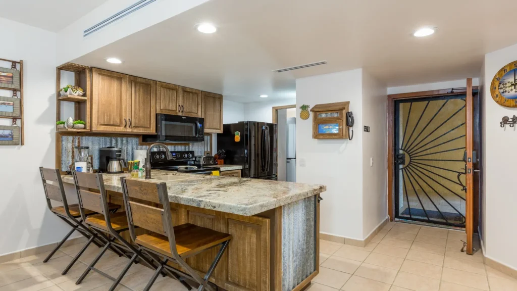 Spacious kitchen with bar seating in Sandy Beach condo