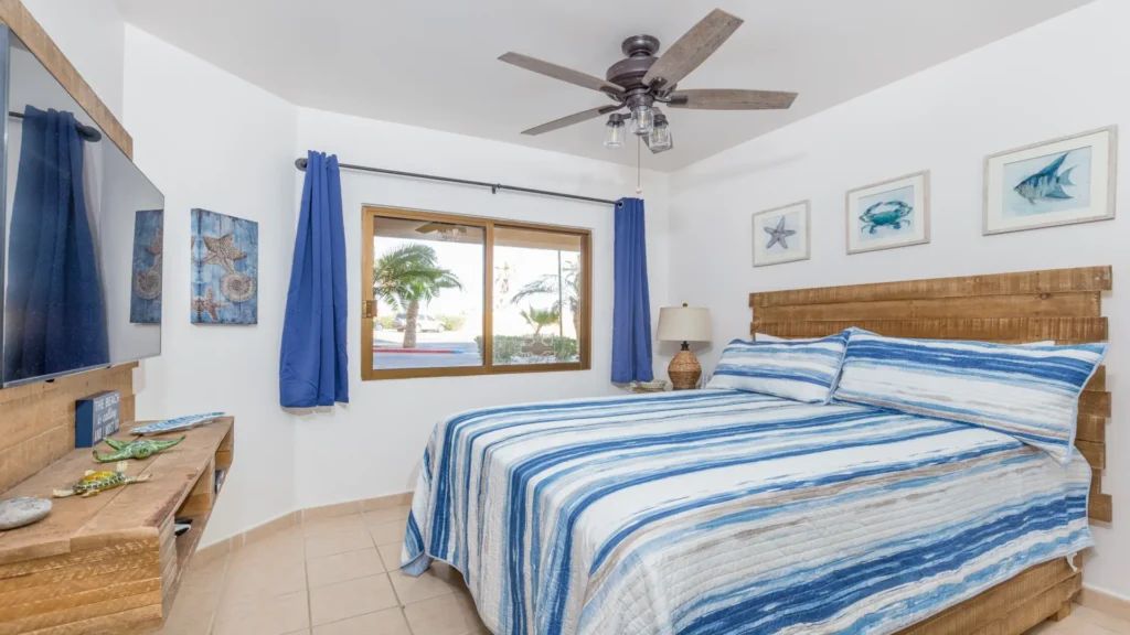 Second bedroom with coastal blue decor in Sandy Beach condo