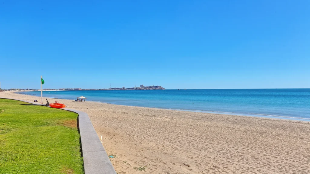 Sandy Beach shoreline and ocean views just steps from beachfront condo patio