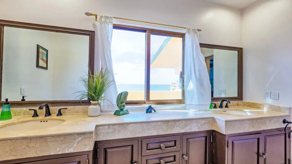 Bathroom vanity and sink area in the E501 2BD two-story penthouse at Princesa Sandy Beach, Rocky Point.