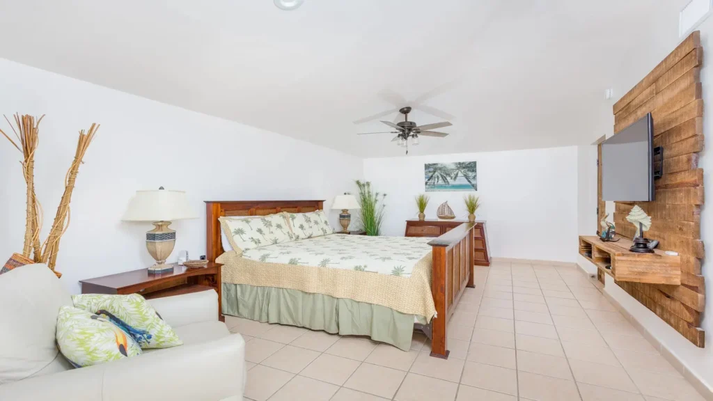 Master bedroom bed and furnishings in the E501 2BD two-story penthouse at Princesa Sandy Beach in Rocky Point.