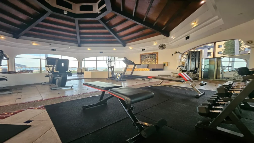 Princesa Resort fitness center with free weights and strength equipment near the E501 2BD beachfront penthouse in Rocky Point.