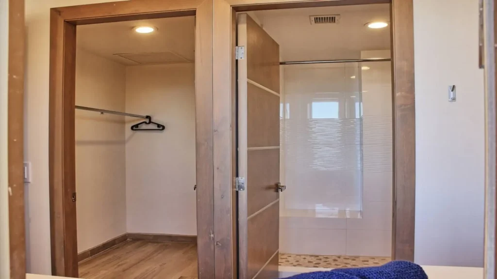 Stylish modern lighting and decor in the clean bathroom of 3BD D503, complementing the coastal theme at Rocky Point Sandy Beach.