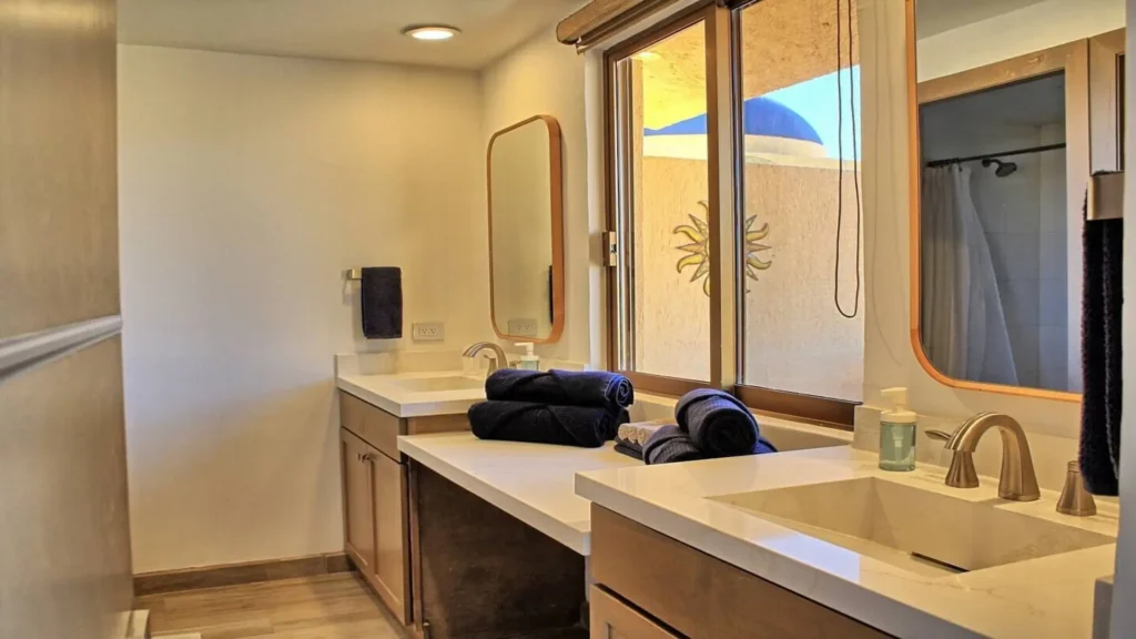 Modern, spacious bathroom vanity in 3BD D503, featuring a sleek countertop and ample space at Rocky Point Sandy Beach.