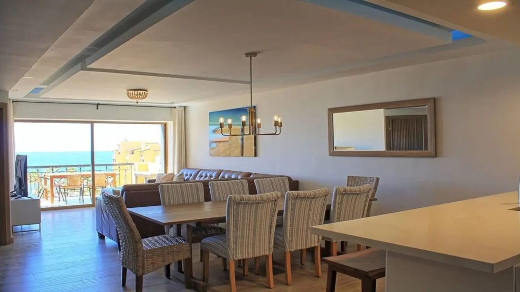 Elegant interior dining area of 3BD D503, perfectly positioned to enjoy the Rocky Point view while eating.