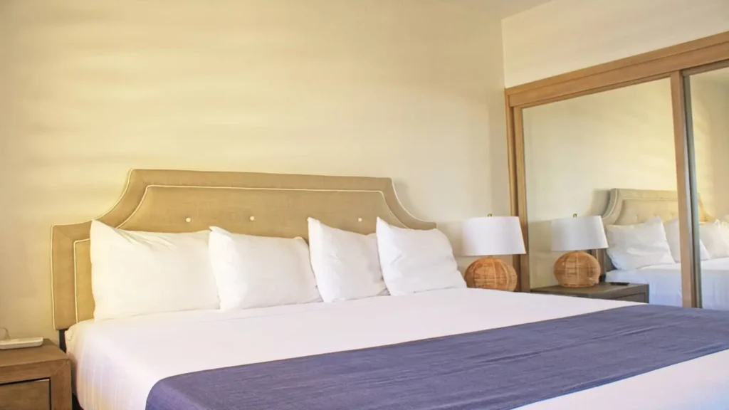 Comfortable king bed in the spacious guest bedroom of 3BD D503, designed for a restful stay at Rocky Point Sandy Beach.