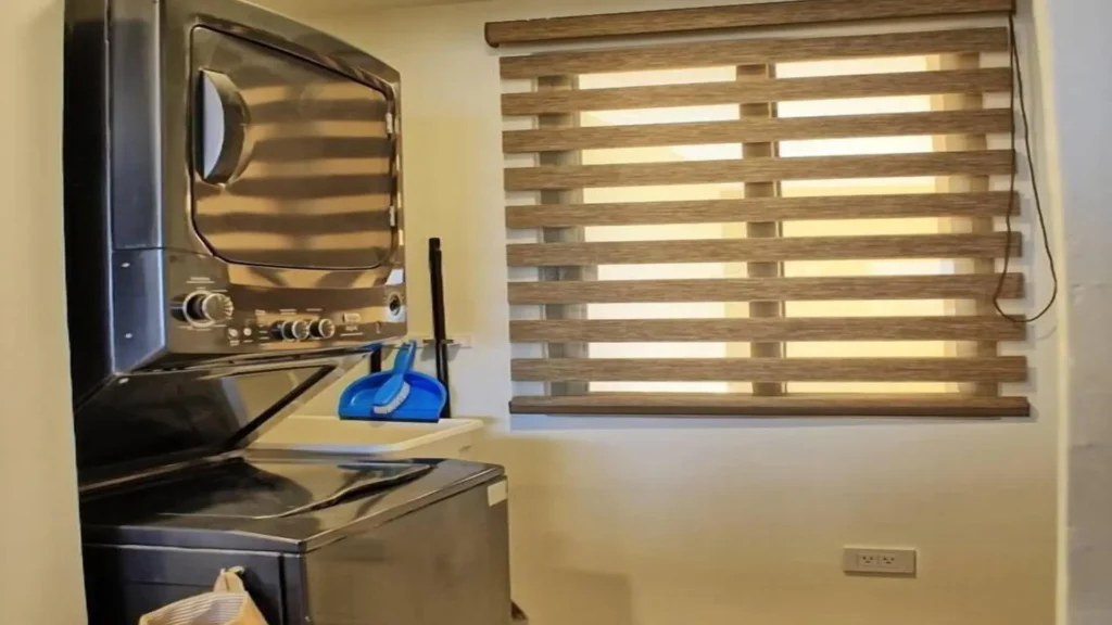Convenient in-unit laundry area in 3BD D503, featuring a full-sized washer and dryer for guest use at Rocky Point Sandy Beach.