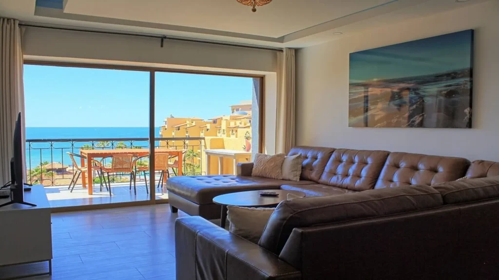 Focus on the high-end, contemporary furnishings and comfortable sofa in the main living space of 3BD D503.