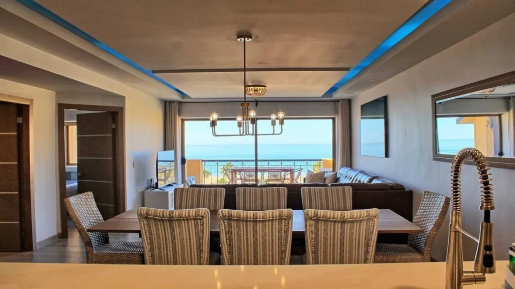 Wide view demonstrating the open-concept flow between the living room, dining area, and kitchen in 3BD D503