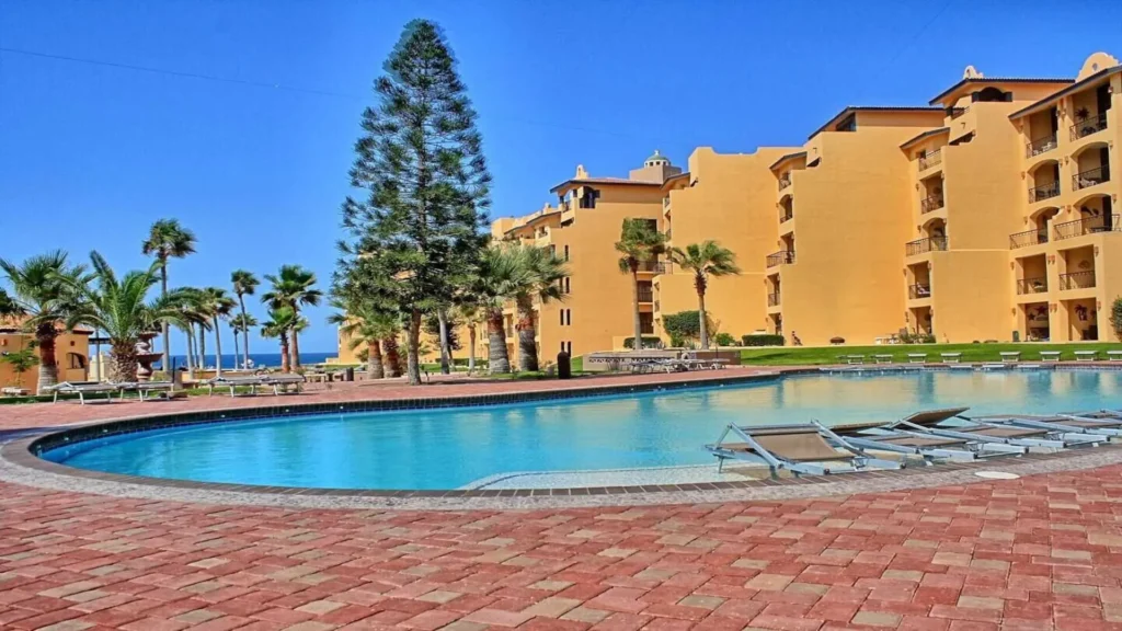 The inviting Princesa Resort pool area with comfortable sun loungers and shady palapas, accessible from 3BD D503 at Rocky Point Sandy Beach.