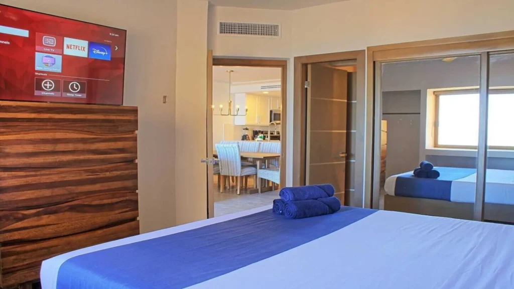 Spacious and modern primary bedroom ensuite in 3BD D503, featuring high-end fixtures and a sleek interior near Rocky Point Sandy Beach.