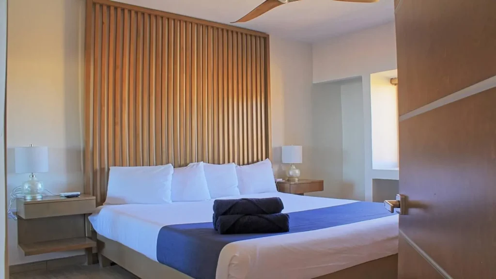 Spacious primary king bed in 3BD D503, offering ultimate comfort and a tranquil retreat at Rocky Point Sandy Beach.