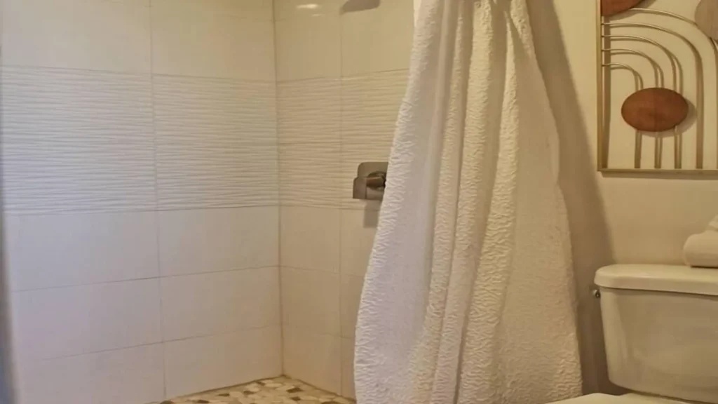 Modern and spacious walk-in shower in one of the guest bathrooms of 3BD D503.