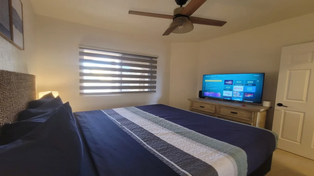 Guest room with dresser, and closet space offer plenty of storage.