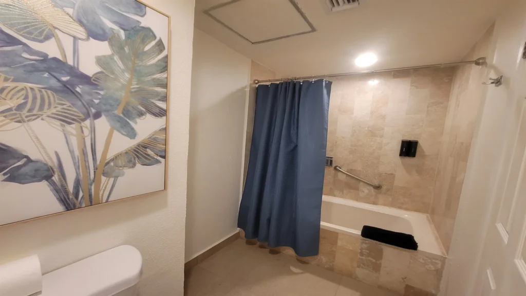 Master bathroom. Please note: this space will soon be converted to a stand-up shower only. Depending on timing, your stay may include either a tub setup or a stand-up shower. By booking, you acknowledge and accept this possible