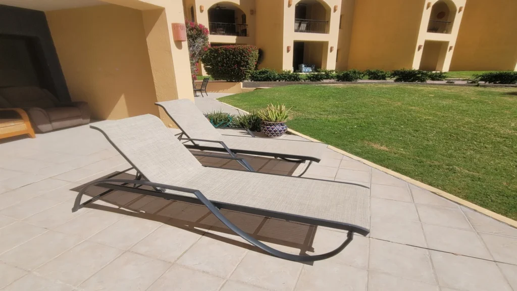 Sun lounge chairs perfect for relaxing, soaking up the sun, and unwinding in comfort by the patio or pool.